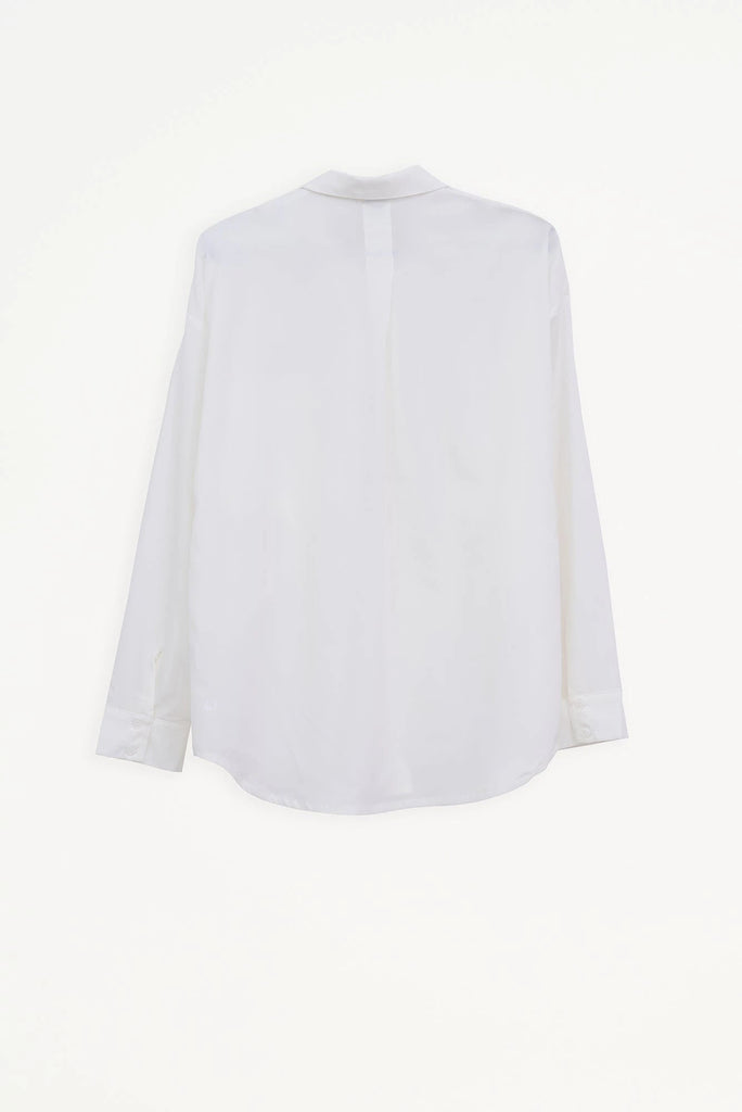 Camisa Mujer Tantä Hazo confeccionada en tejido ligero de secado rápido. Color Blanco 