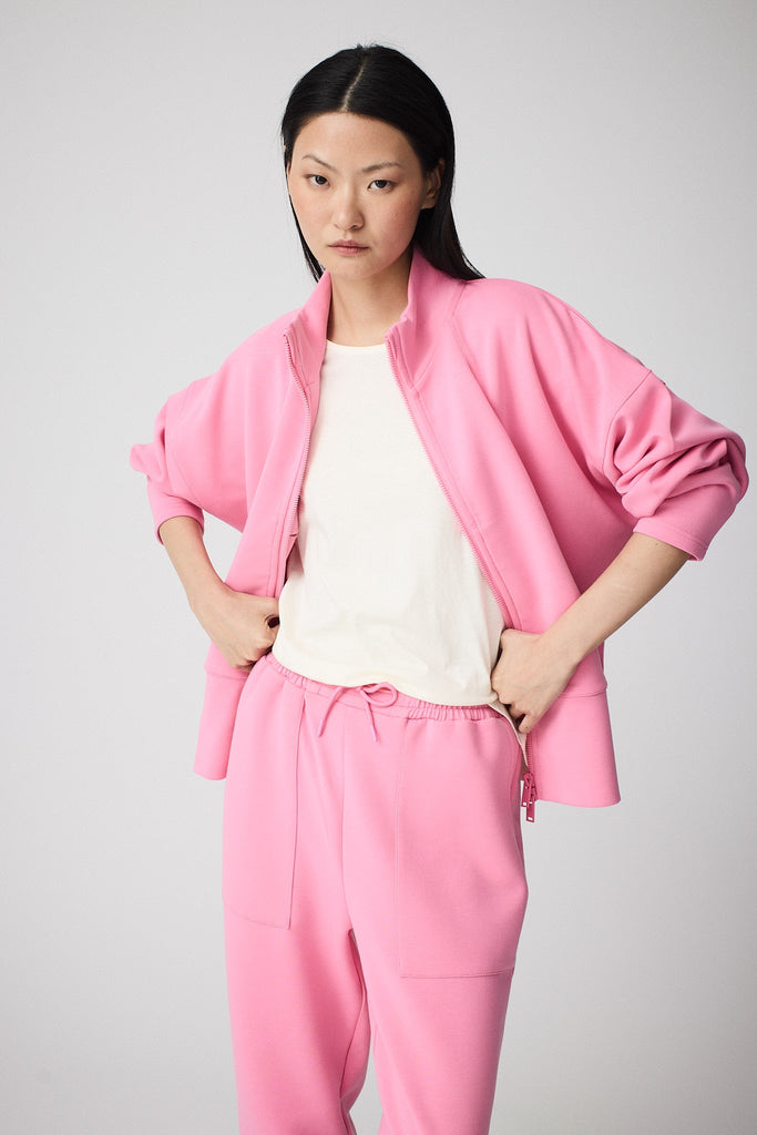 Sudadera de Mujer Tantä con cremallera en tejido interlock secado rápido. Color Rosa 
