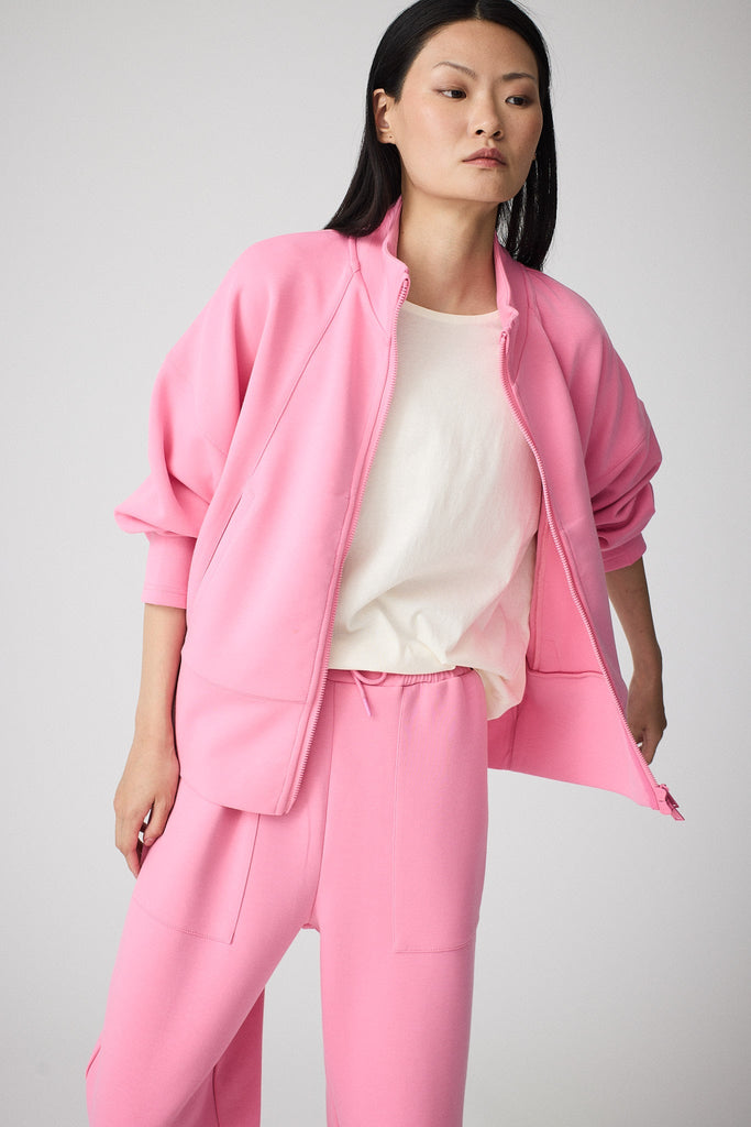 Sudadera de Mujer Tantä con cremallera en tejido interlock secado rápido. Color Rosa 