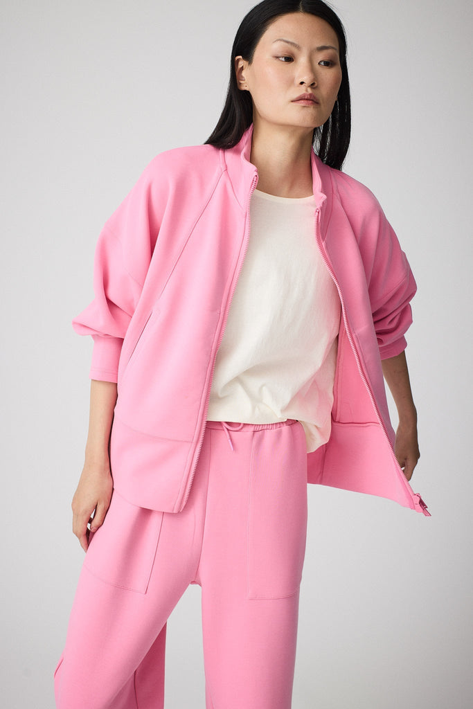 Sudadera de Mujer Tantä con cremallera en tejido interlock secado rápido. Color Rosa 