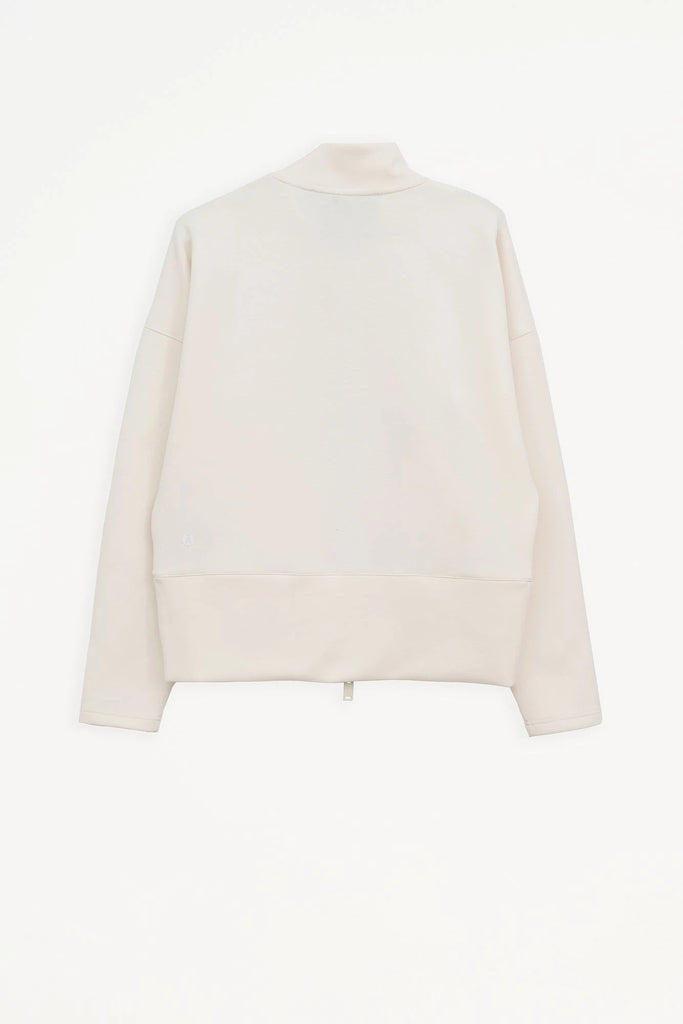 Sudadera de Mujer Tantä con cremallera en tejido interlock secado rápido. Color Blanco roto 