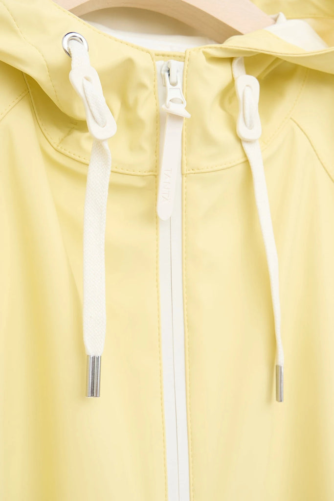 Chaqueta impermeable en poliéster reciclado de mujer SKY Tantä. Color amarillo