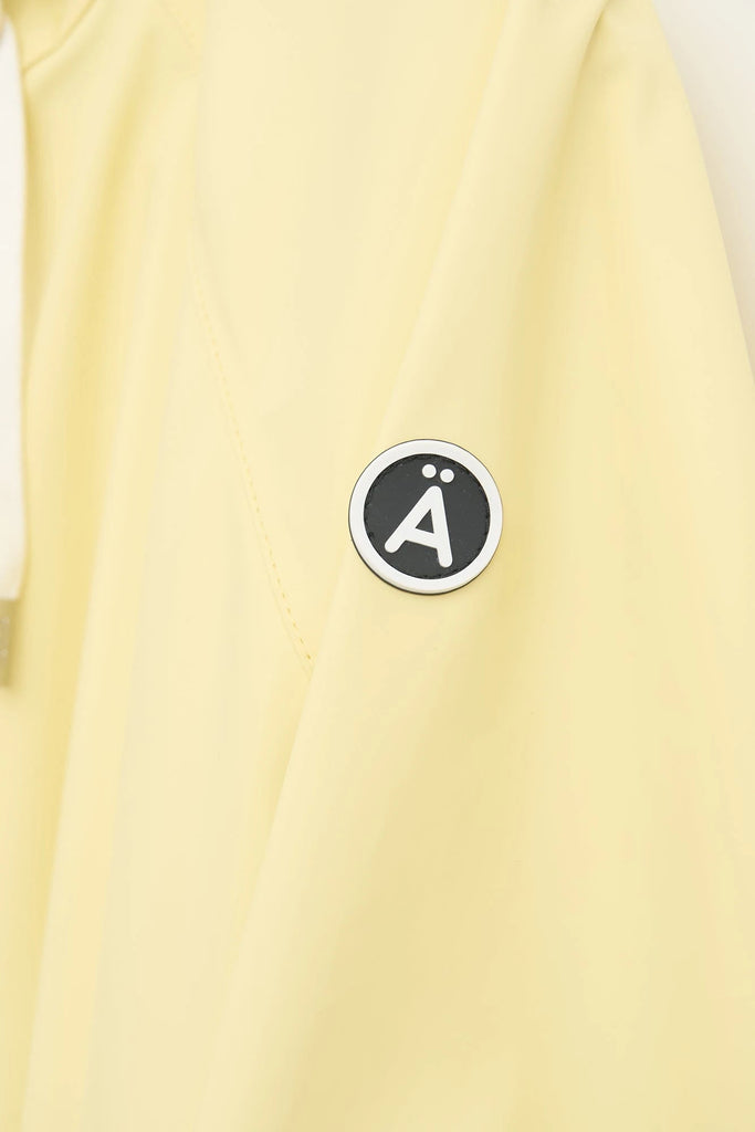 Chaqueta impermeable en poliéster reciclado de mujer SKY Tantä. Color amarillo