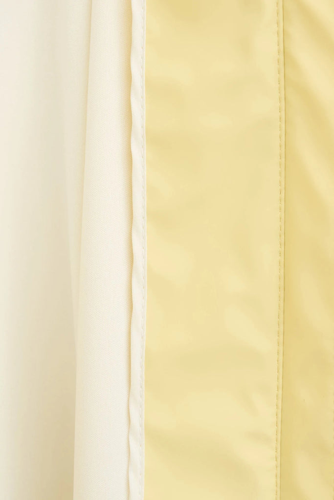 Chaqueta impermeable en poliéster reciclado de mujer SKY Tantä. Color amarillo