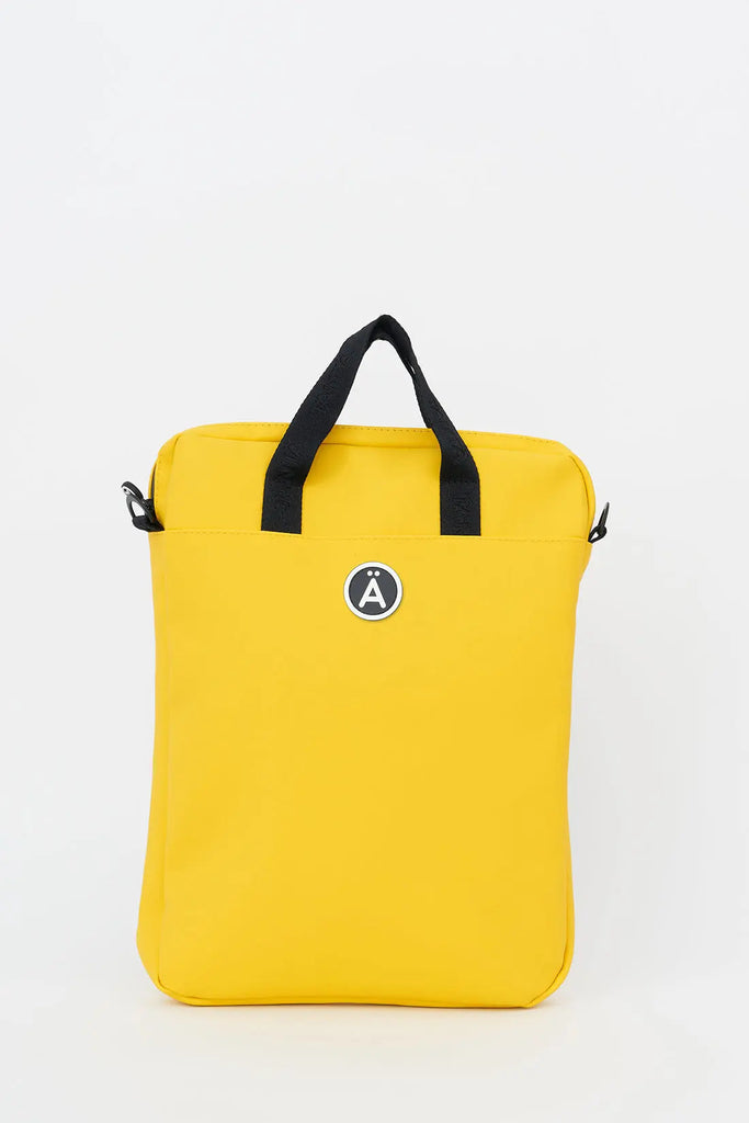 Bolso impermeable Tantä perfecto para tu aparato electrónico. Color amarillo. Ceobhrán Lemon Chrome