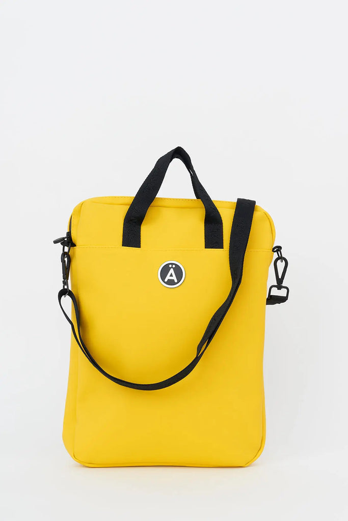 Bolso impermeable Tantä perfecto para tu aparato electrónico. Color amarillo. Ceobhrán Lemon Chrome
