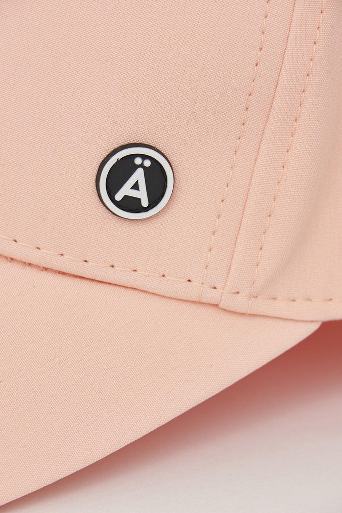 Gorra de béisbol color melocotón confeccionada en softshell ligero Tantä